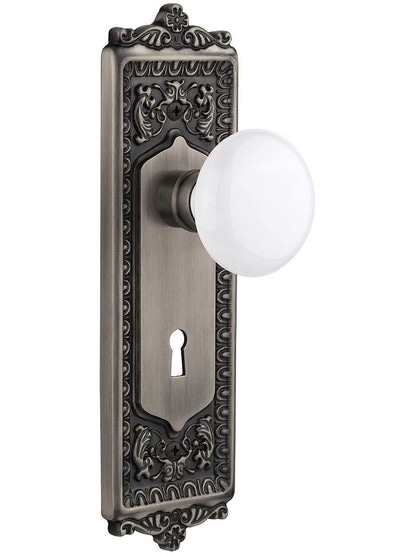 Egg and Dart Door Set with White Porcelain Knobs and Keyhole - 2 3/8 in Antique Pewter.